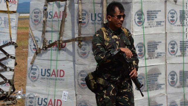 A Philippine soldier guards U.S. aid at the Tacloban airport on November 15. 