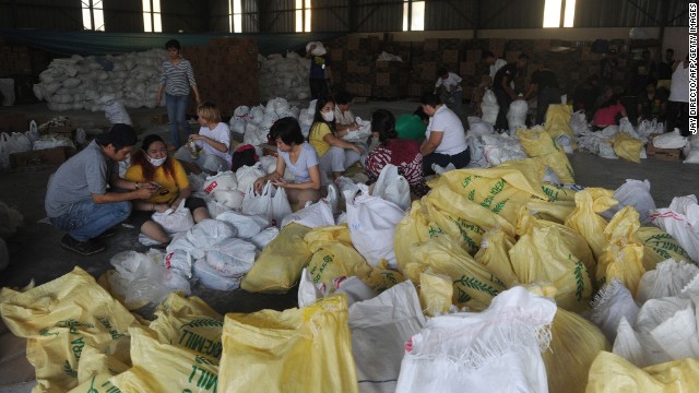 Volunteers in Manila, Philippines, prepare relief goods for typhoon survivors on Thursday, November 14.