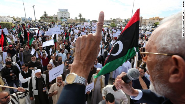 Libyan protesters gather during a demonstration calling on militiamen to vacate their headquarters in southern Tripoli on November 15, 2013.