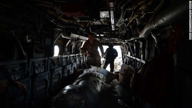 A U.S. Army Ranger unloads aid from an Osprey aircraft November 16 in Balangiga, Philippines.