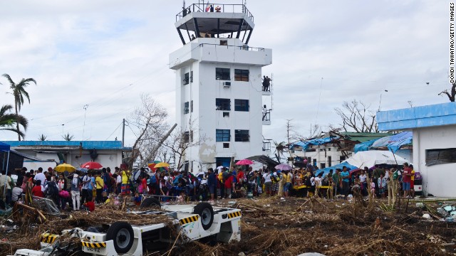 Survivors gather in Tacloban to await transport to a neighboring province on November 16.