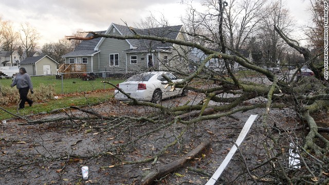 A fallen tree blocks traffic on November 17 in Marion, Indiana.