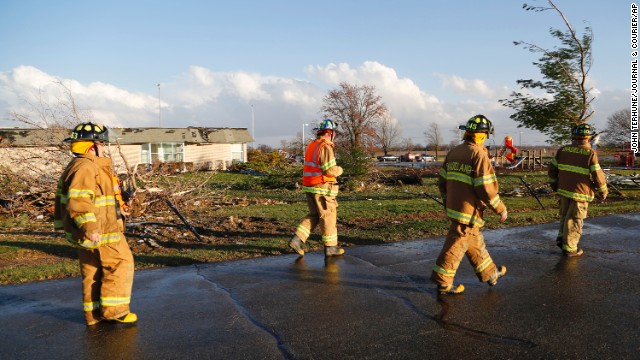 Firefighters survey the damage at Mintonye Elementary School in Lafayette, Indiana, on November 17. A series of strong thunderstorms pounded Tippecanoe County, northwest of Indianapolis, on Sunday.