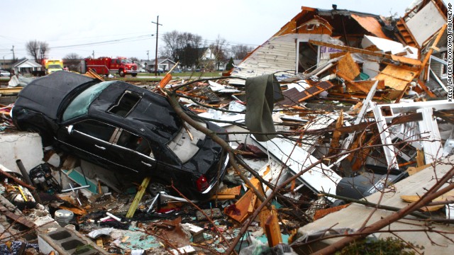 A car sits among the debris of a leveled home in Kokomo, Indiana, on November 17.