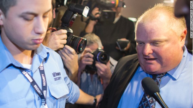  Toronto Mayor Rob Ford is surrounded by the media as he leaves his office at Toronto City Hall on November 15. 