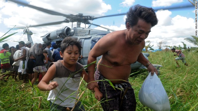 A U.S. Navy helicopter delivers relief goods to typhoon victims in Ormoc, Philippines, on November 18.