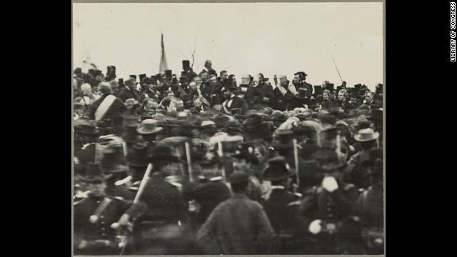 A crowd gathers to hear President Abraham Lincoln deliver the Gettysburg Address on November 19, 1863. Lincoln is seen in the center, just to the left of the bearded man with a top hat.