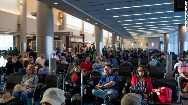 Passengers wait for flights in the International Terminal.