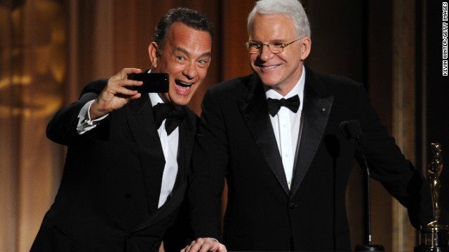 Tom Hanks takes a selfie with fellow actor Steve Martin at the 2013 Governors Awards. "Selfie" has been named the global <a href='http://www.cnn.com/2013/11/19/living/selfie-word-of-the-year/index.html'>word of the year</a> by Oxford Dictionaries. Click through the gallery to see other celebrities taking selfies. 