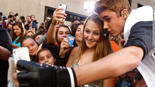 Singer Justin Bieber takes a selfie with a fan before appearing on NBC's "Today" show.