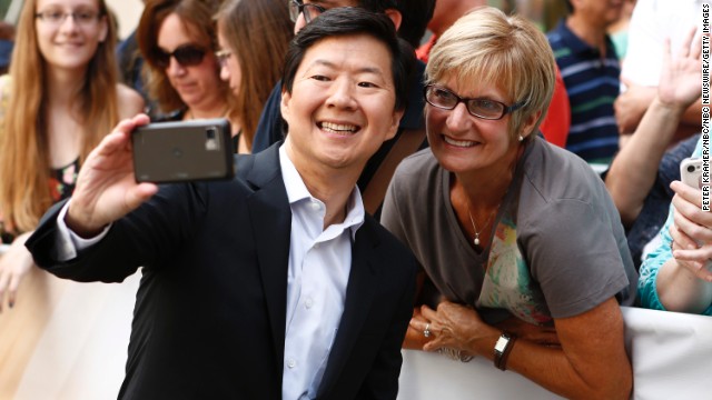 Actor Ken Jeong takes a photo with a fan before appearing on NBC's "Today" show.