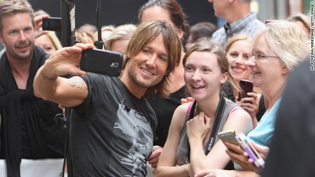 Musician Keith Urban takes a selfie with a fan before performing at NBC's "Today" show. 