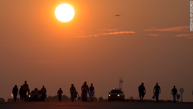 Airport employees take part in the annual Foreign Object Debris, or FOD, removal walk.