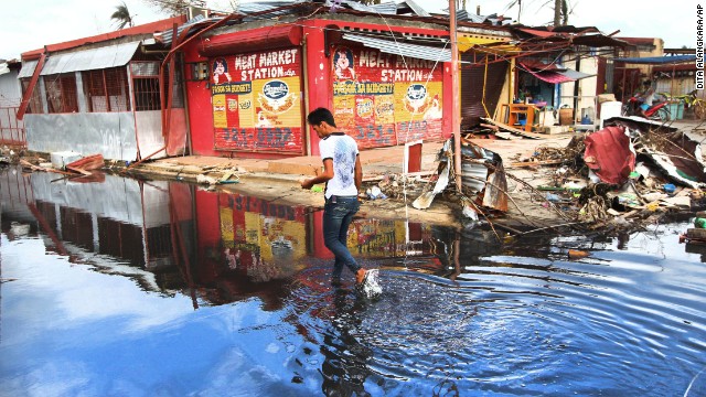 A man walks through water in the typhoon-ravaged city of Tacloban, Philippines, on November 20. 