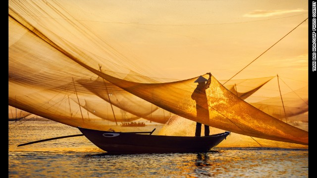 This Vietnamese man tends to his fishing nets in the morning and sells his catch at the local markets in the afternoon.