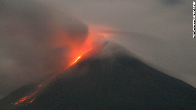 Western Mexico's Colima volcano in emits lava on October 2, 2004. The Global Volcanism Program reported "a bright thermal anomaly" as well as gas emission on November 9. 