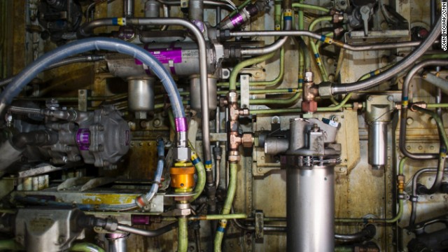 Pipes, cables and pumps line the interior of a wheel well on a Southwest Airlines plane.