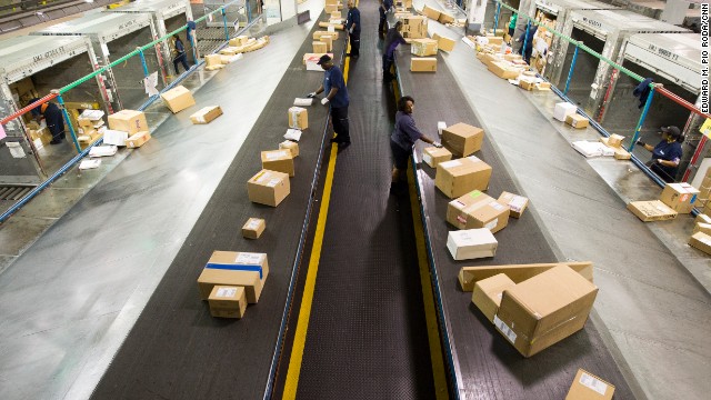 Packages are sorted at the FedEx cargo facility.