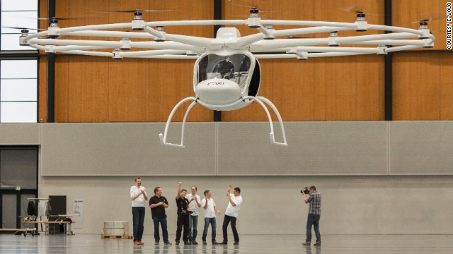 German engineers celebrate as the Volocopter, one of the world's first electric helicopters, takes off on its maiden flight.