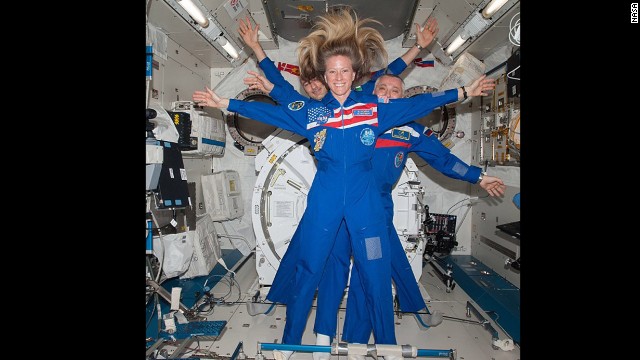 NASA astronaut Karen Nyberg takes a selfie with Russian cosmonaut Fyodor Yurchikhin and European Space Agency astronaut Luca Parmitano behind her.