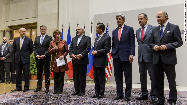 Chief negotiator Catherine Ashton and Iran's foreign minister announce agreement on Iran's nuclear program early on Sunday, November 24 in Geneva. From left to right: British Foreign Secretary William Hague, German Foreign Minister Guido Westerwelle, EU foreign policy chief Catherine Ashton, Iranian Foreign Minister Mohammad Javad Zarif, Chinese Foreign Minister Wang Yi, U.S. Secretary of State John Kerry, Russian Foreign Minister Sergei Lavrov and French Foreign Minister Laurent Fabius.