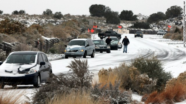 Cars slide on Paseo del Norte in Albuquerque on November 24. The winter weather made driving difficult.