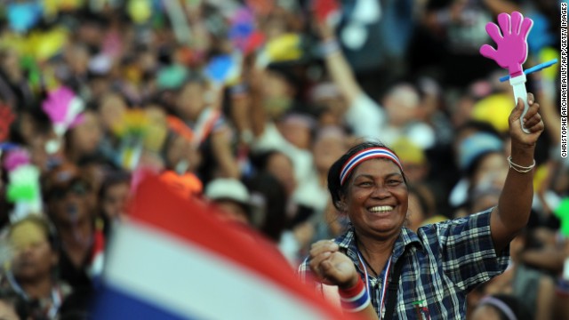A Thai opposition protester waves a clapper during a rally at Bangkok's Democracy Monument Sunday.