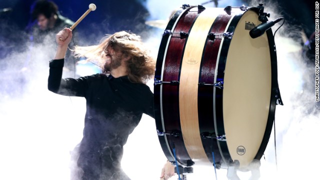 Wayne Sermon of Imagine Dragons bangs a drum during the band's performance.