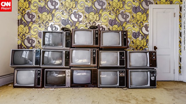 The photographers say they didn't stage photos for this series, making this arrangement of televisions in a New York hotel all the more curious.