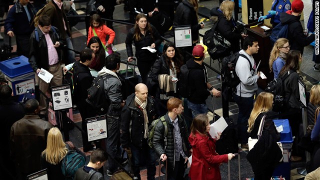 Travelers wait in security lines at Reagan National Airport on November 26.