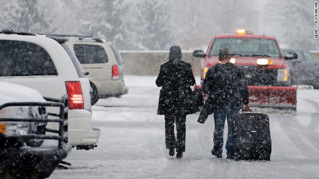 Holiday travelers make their way to their car on November 26 after arriving at Pittsburgh International Airport.