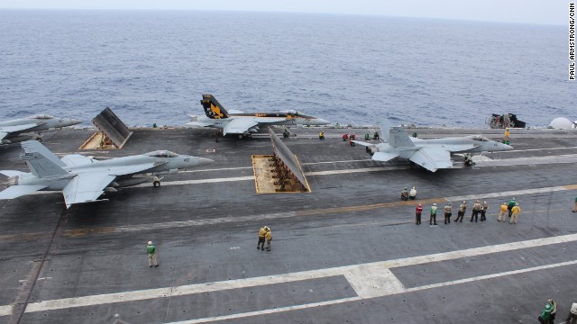 Three fighters prepare to be catapulted off the USS George Washington during training exercises off Okinawa on November 27. They provide the cutting edge to the 90,000-ton "super carrier."