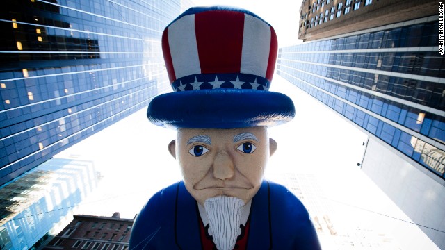 The Uncle Sam balloon is marched down Sixth Avenue.