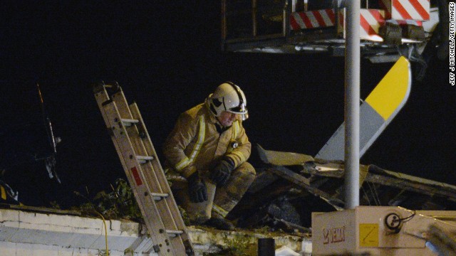 Rescue workers search for survivors inside the pub.