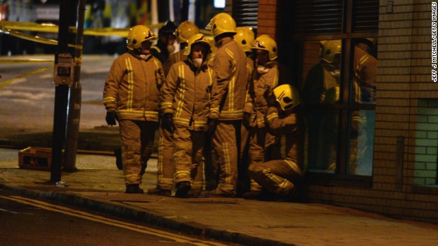 Rescue workers gather near the scene of the crash.