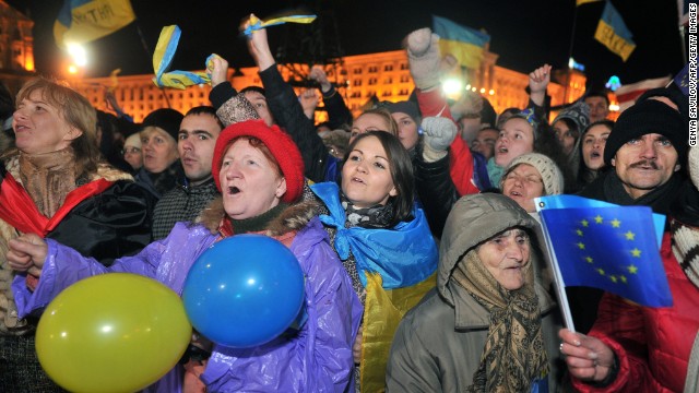 Opposition supporters shout slogans and wave flags on Friday, November 29.