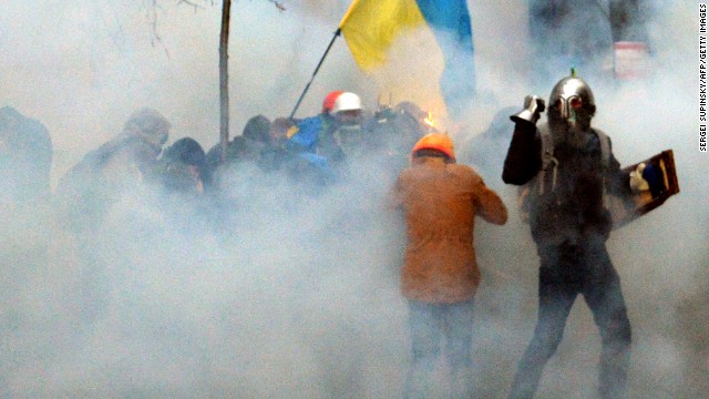 Pro-European Union demonstrators clash with police near the presidential administration office in Kiev on December 1.