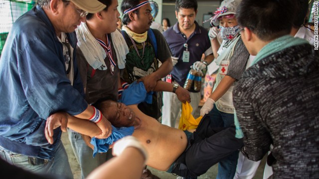 An injured protester is carried on December 1.