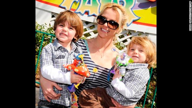 Spears poses with her sons Preston and Jayden in Mickey's Toontown Fair at the Magic Kingdom in Lake Buena Vista, Florida in 2009. 