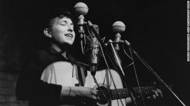 Dylan performs in 1961 at The Bitter End club in New York City. His first album, "Bob Dylan," debuted in 1962 and consisted mostly of old folk songs.