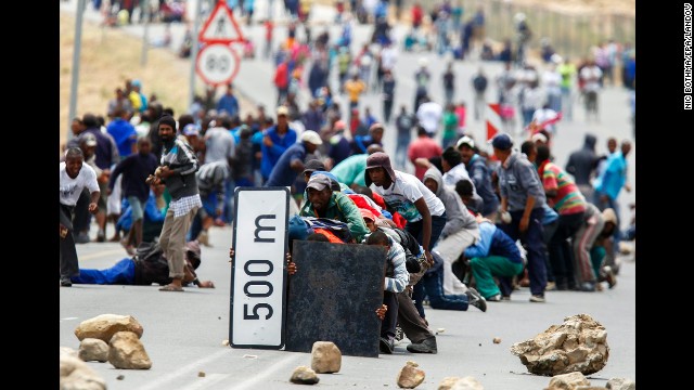 <strong>January 10:</strong> Protesters advance on police in De Doorns, South Africa. Farmworkers across the Western Cape were on strike at the time, demanding that their wages of 65 rand a day ($7.50 U.S.) be doubled.