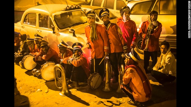 <strong>February 10:</strong> Marching band members wait to perform in the procession that leads to the banks of Sangam, the confluence of three holy rivers, during the Maha Kumbh Mela festival in Allahabad, India.