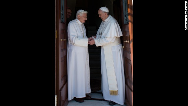 <strong>May 2:</strong> Pope Emeritus Benedict XVI, left, is welcomed by his successor, Pope Francis, as he returns to the Vatican. The former pope retired in February.