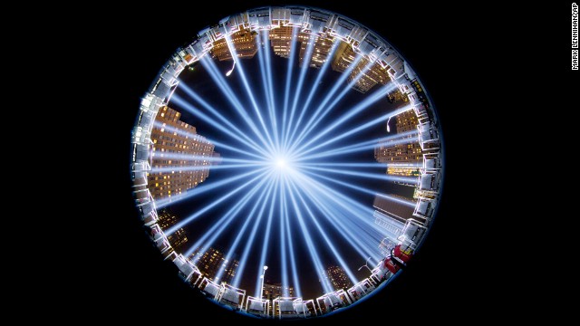 <strong>September 10:</strong> The Tribute in Light, a collection of 88 searchlights next to the site of the World Trade Center, is seen through a fish-eye lens as it rises above buildings in lower Manhattan. 