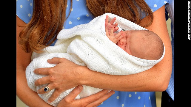 <strong>July 23:</strong> The Duchess of Cambridge holds her newborn son, Prince George, outside St. Mary's Hospital in London. George is third in line to the British throne after his grandfather Prince Charles and his father, Prince William. 