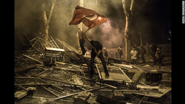 <strong>June 1:</strong> A protester is hit by tear gas in the Besiktas neighborhood of Istanbul. Thousands of people gathered to protest the government and its plans to demolish Istanbul's Gezi Park.