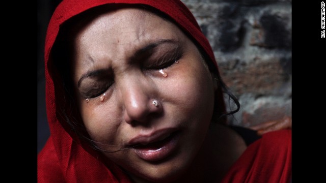 <strong>March 10:</strong> A Pakistani Christian woman weeps after her home was damaged by an angry Muslim mob during clashes between Christians and Muslims in Lahore, Pakistan.