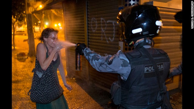 <strong>June 17:</strong> A military police officer pepper-sprays a protester in Rio de Janeiro. Millions of Brazilians took to the streets this summer to protest years of dissatisfaction and discontent with their government. 