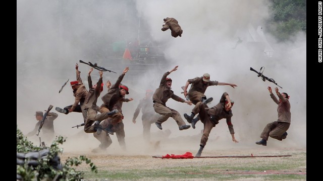 <strong>June 22:</strong> South Korean soldiers wear North Korean military uniforms as they take part in a Korean War re-enactment in Chuncheon, South Korea.