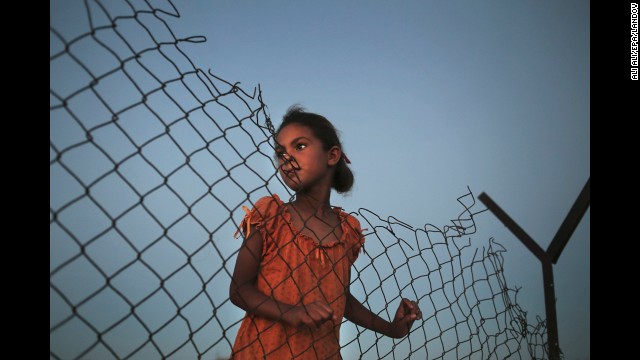 <strong>July 29:</strong> A Palestinian girl plays beside her family's tent in a poverty-stricken area of Gaza.